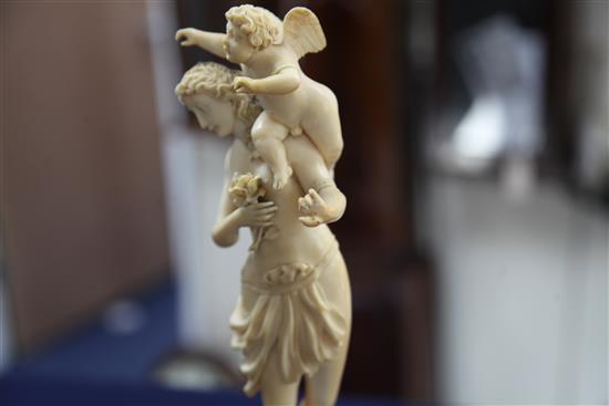 A 19th century French Dieppe ivory carving of Venus and Cupid, Overall H.13.25in.